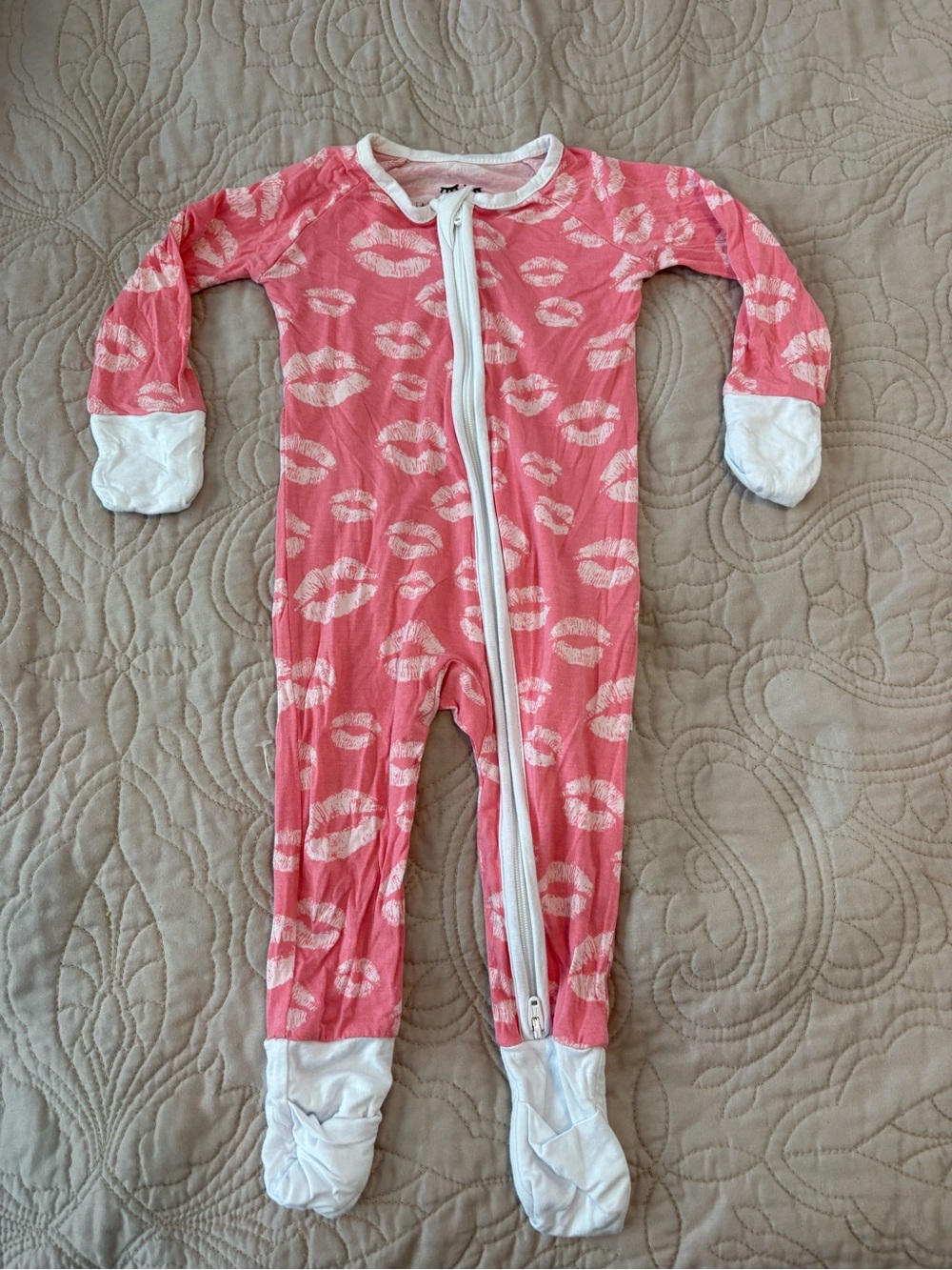 Little Sleepies Coral Pink Kiss-Print Footed One-Piece
